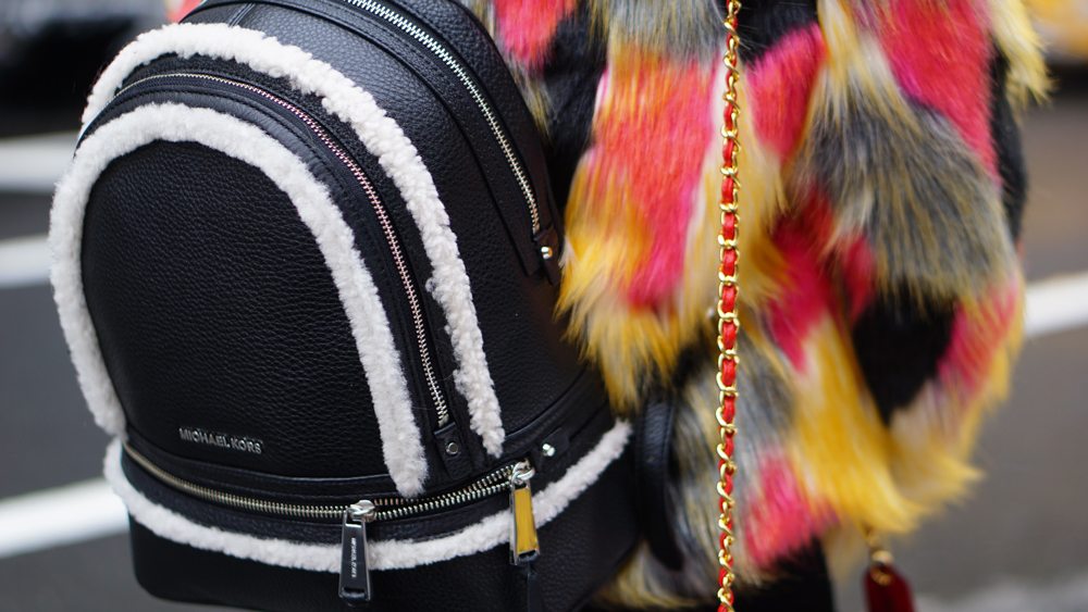 women backpack + best backpack 2018 - Inuikii Boots, faux fur multi-color coat, backpack Michael kors black leather and sherling. New York Fashion Week Street Style Look. More NYFW Winter Layering Looks on Houseofcomil.com. Click to read more or pin to save it for later.