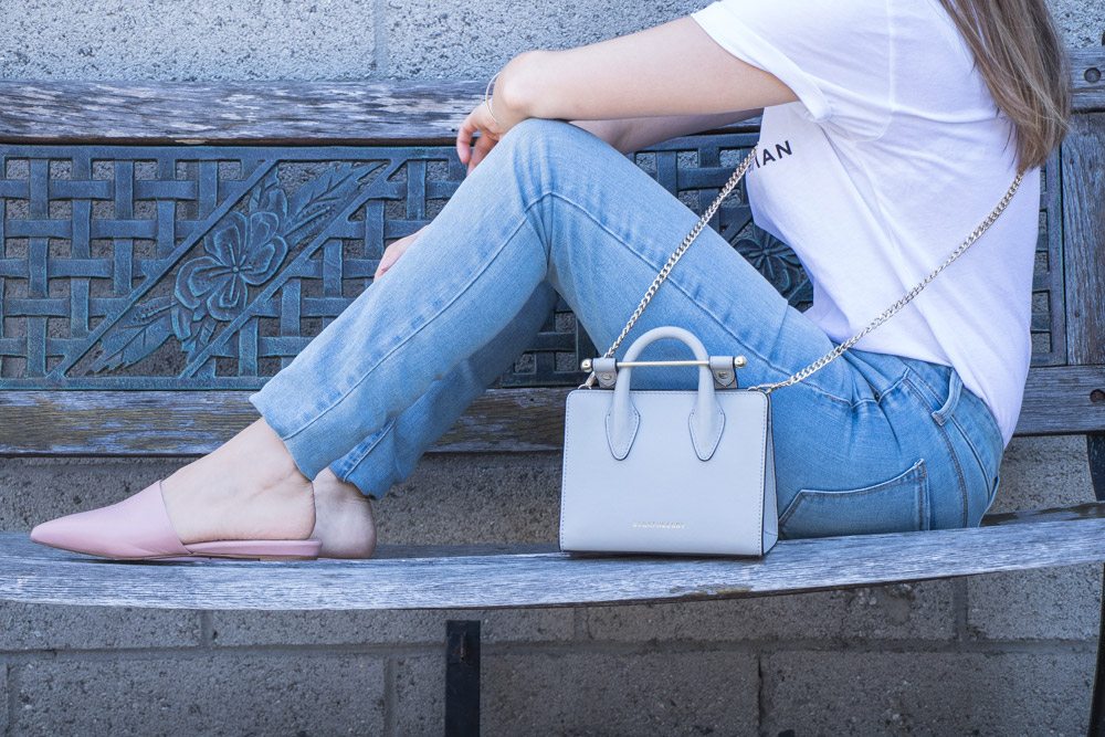 The Strathberry Nano Tote is defined by understated styling and the iconic Strathberry bar closure.