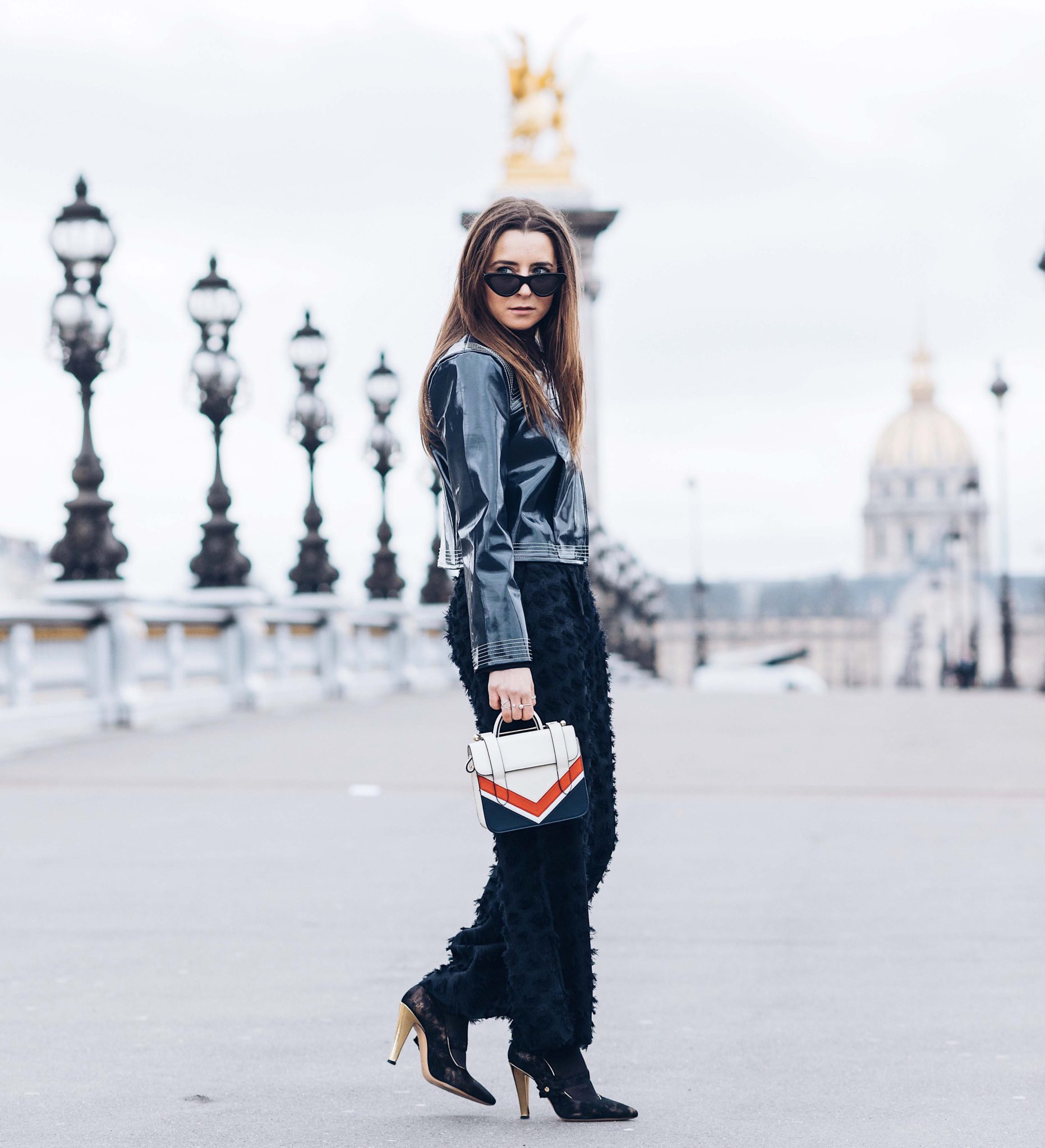 Best Street Style Paris Fashion Week Mars 2018 of Julia Comil / French Fashion Blogger in Los Angeles - Outfit for Chanel Fall Winter 2018 2019 show - Ganni Motor Jacket - Strathberry bag - Gold shoes Dimmino