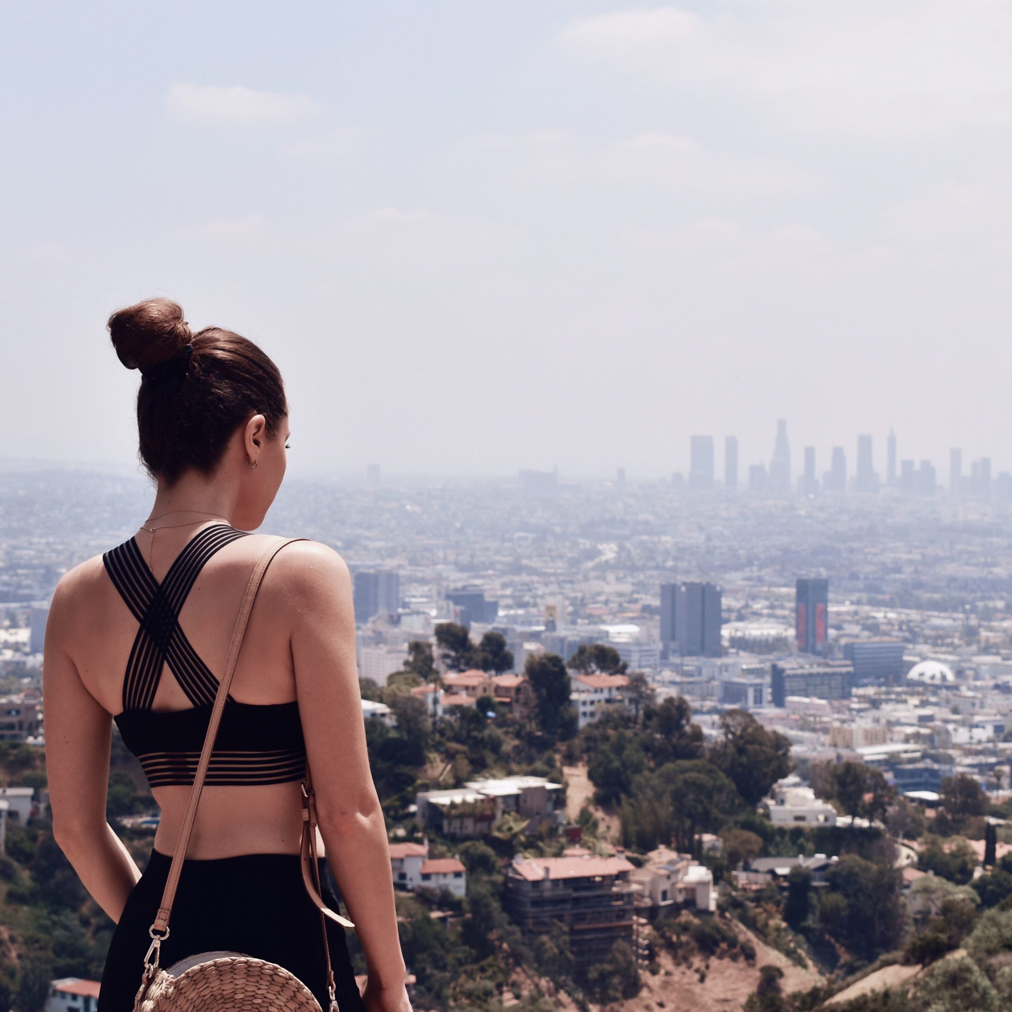 Fashion Diaries: Revolve Around The World Parties in Los Angeles - Lovewave sport bra and black leggings worn by Fashion Blogger Julia Comil. More on Houseofcomil.com. Pin to read it later. Location Runyon Canyon Los Angeles - Active wear outfit runyon canyon