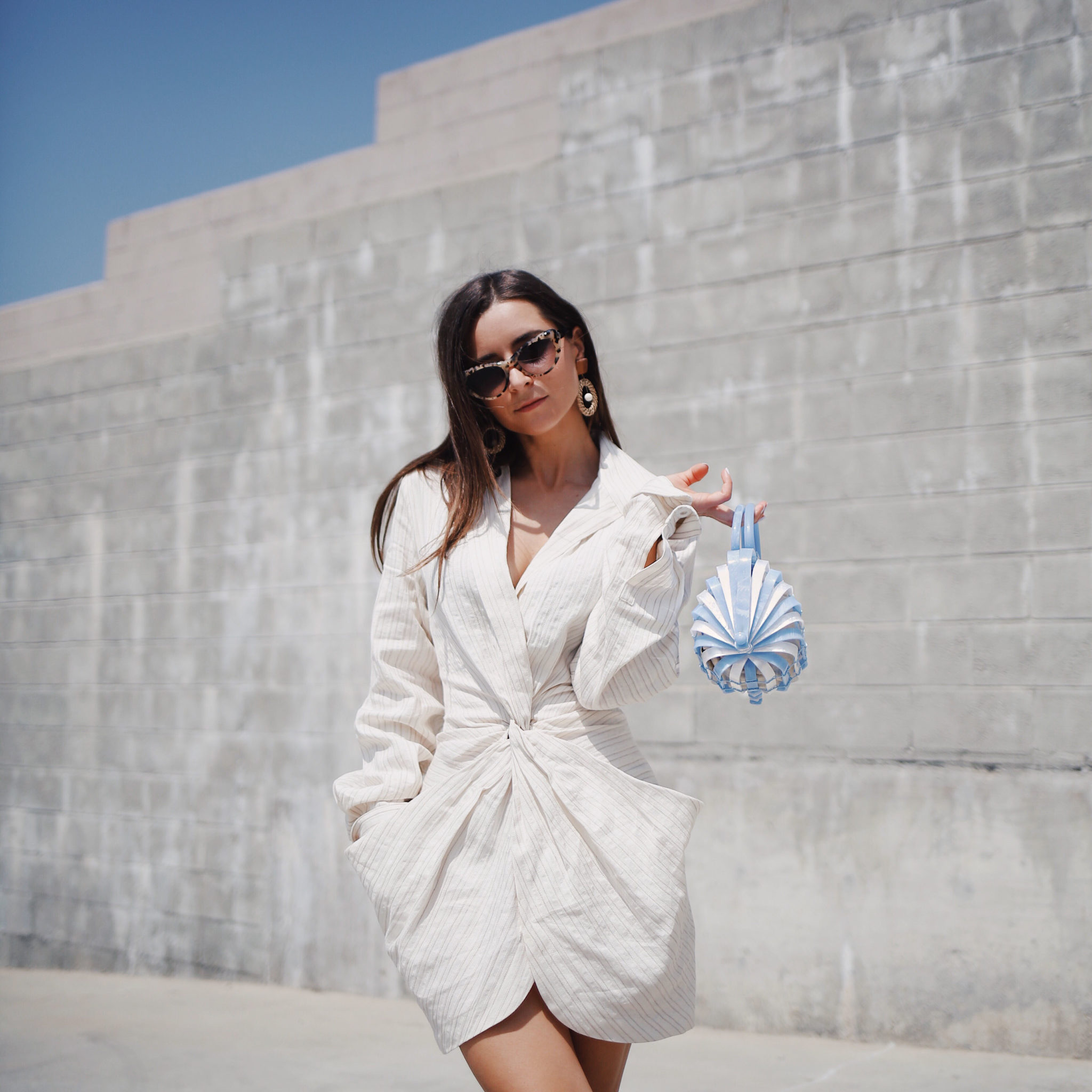 Discover Jacquemus the French Not So Parisian Designer on Houseofcomil.com. French Fashion Blogger Julia Comil is wearing a Jacquemus Dress, Bag Cult Gaia, and Krewe x Reformation sunglasses in Los Angeles