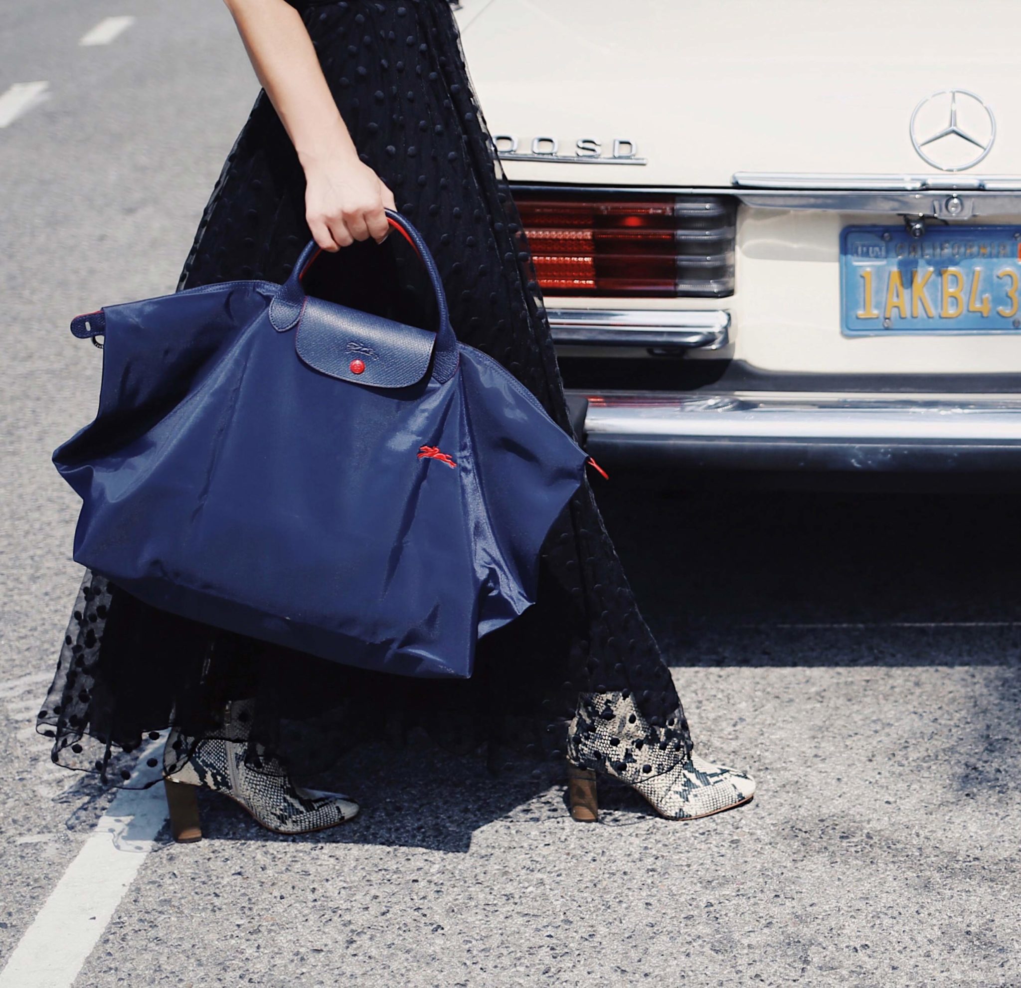 Best snakeskin boots fall winter 2020: Longchamp bag and Snake prints ankle boots from Pour La Victoire - How to wear the snakeskin ankle boots this fall - More on Modersvp.com