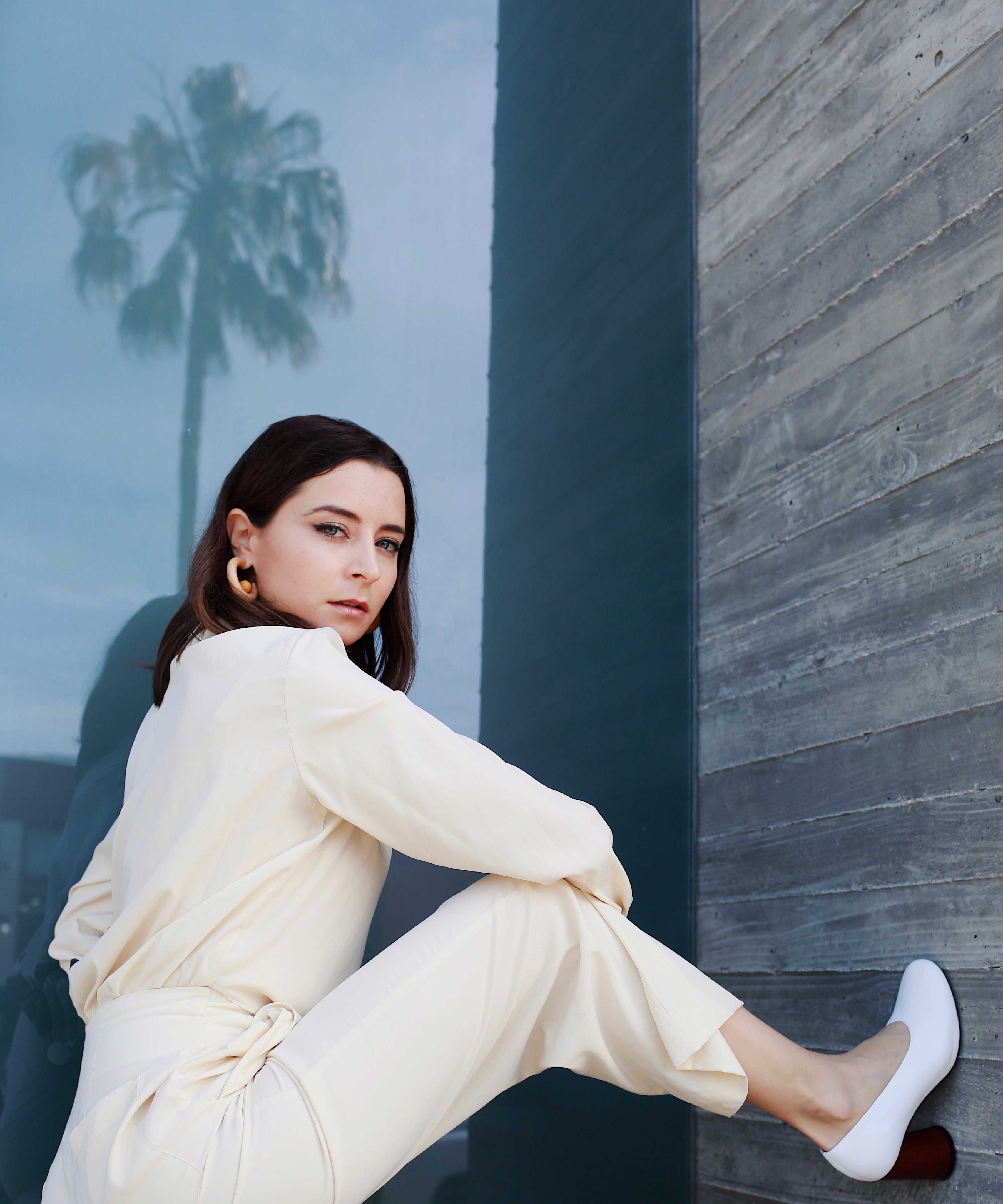How to wear the white suit for women. White party outfit ideas and summer outfit ideas are on Modersvp.com. White suit from Ba&Sh Paris worn by Julia Comil vanilla jumpsuit via Nanushka