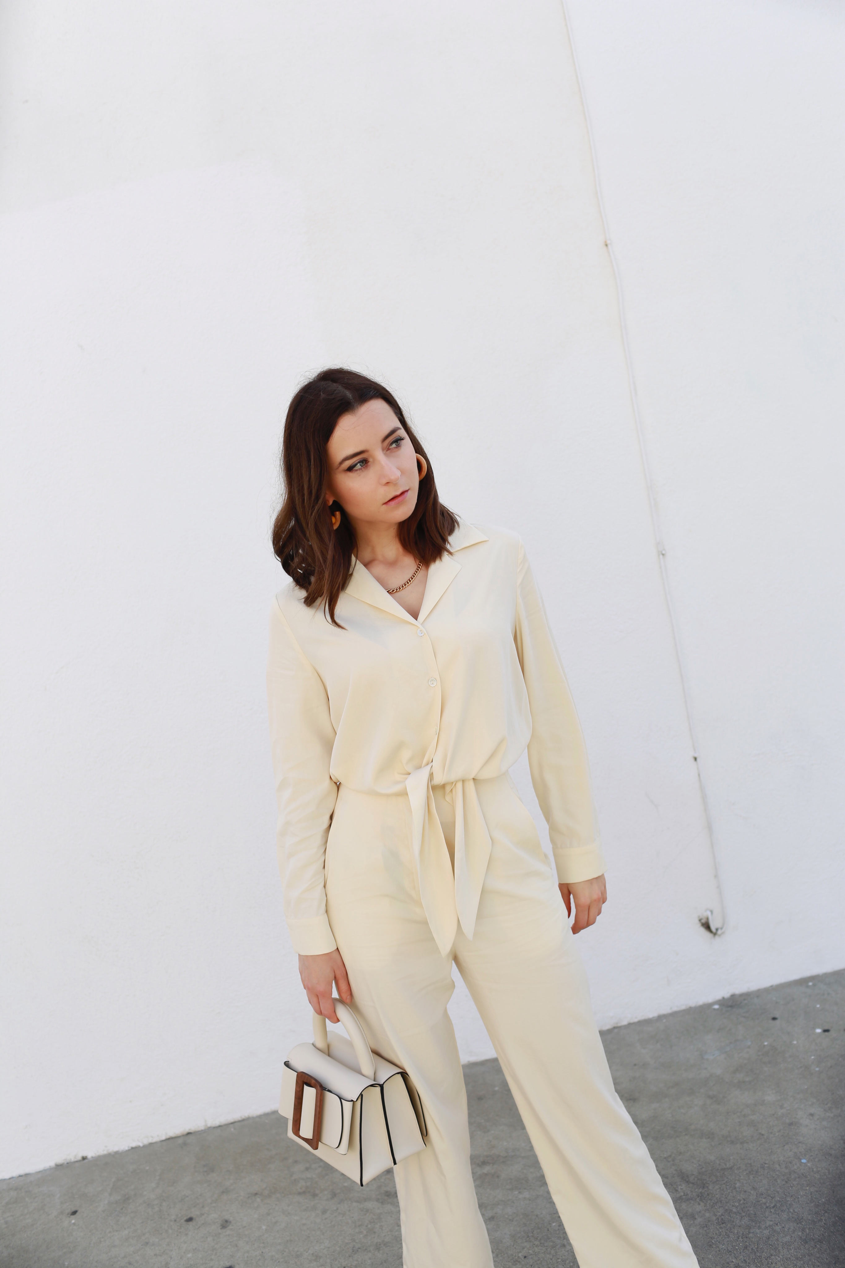 How to wear the white suit for women. White party outfit ideas and summer outfit ideas are on Modersvp.com. White suit from Ba&Sh Paris worn by Julia Comil vanilla jumpsuit via Nanushka