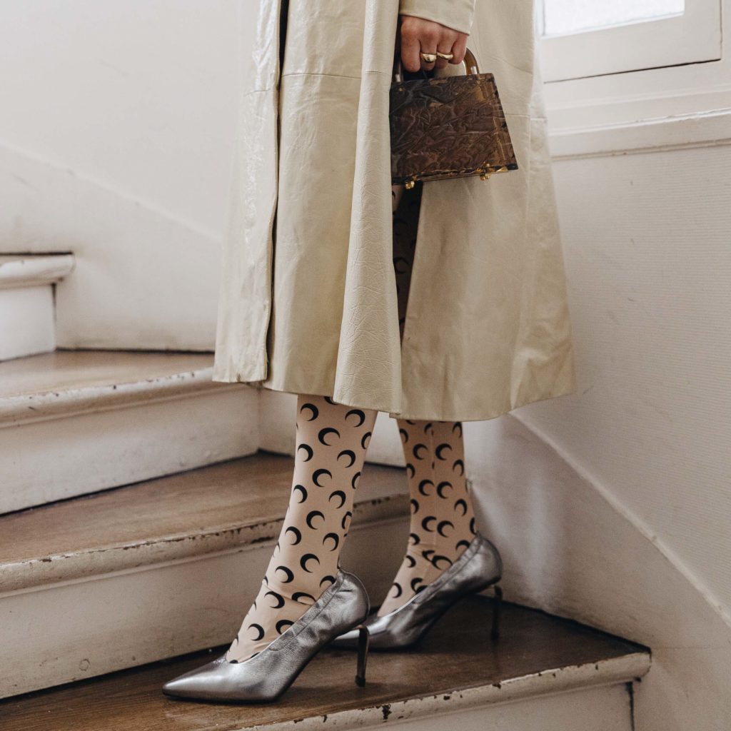 martine serre monogram gift idea tights PFW SS20 Street Style Fall 2019 Paris Fashion Week Julia Comil wearing Madiyahalsharqi coat, bag Lilianafshar, pumps Clergerie, Tights Marine Serre