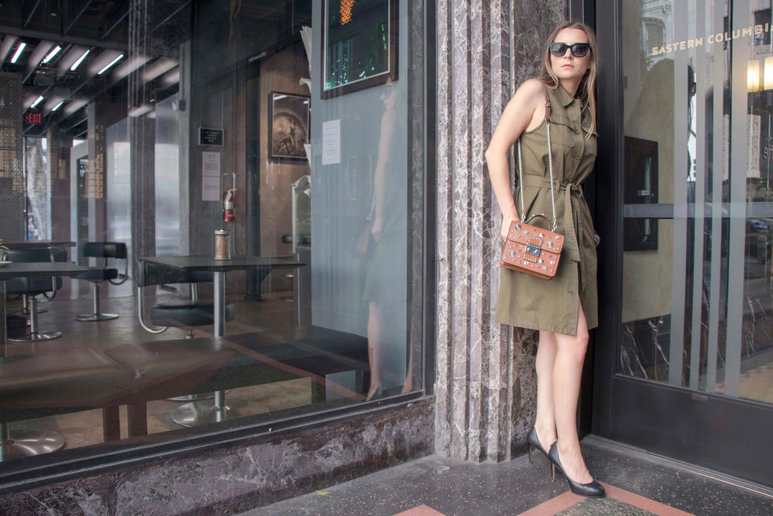 Fall dresses 2017: How to transition from summer to fall with the sleeveless shirt dress - Effortless chic dress from Zan Style and studded brown satchel bag from Lollo Vita. More on MODERSVP.com