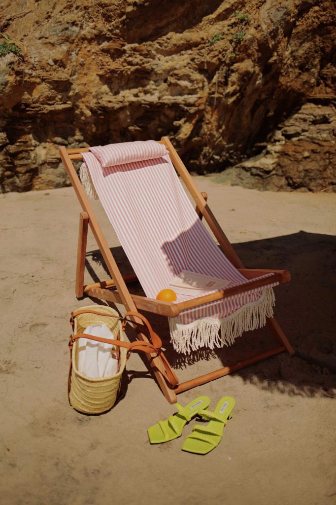 Business and pleasure vintage beach umbrella and vintage beach chairs