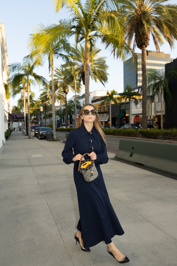 Effortless pieces to get at the Tory Burch sale - Museum Goer look loafer dress and monogram bucket bag y2k fashion 2000s fashion