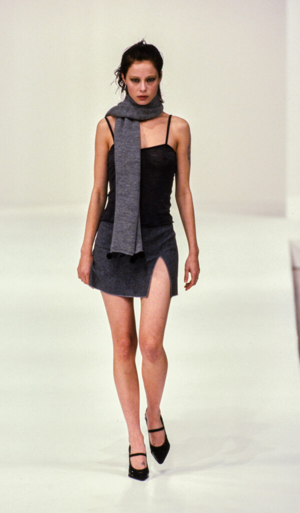 Throwback to Miu Miu Mid 90s runway looks that are so relevant in 2024. Discover more looks on Modersvp.com by Julia Comil. Little black dress with slit