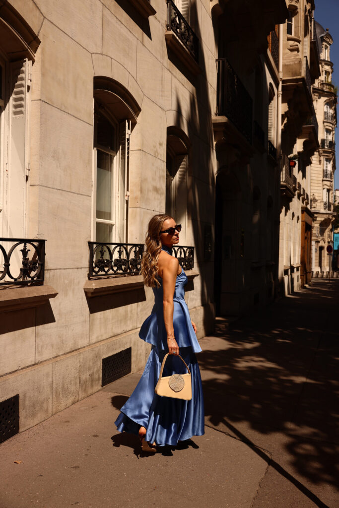 paris couture week julia comil wearing Ardazaei blue silk biais cut skirt and top destree beige bag and brown malone souliers shoes julia comil at couture week paris fashion week