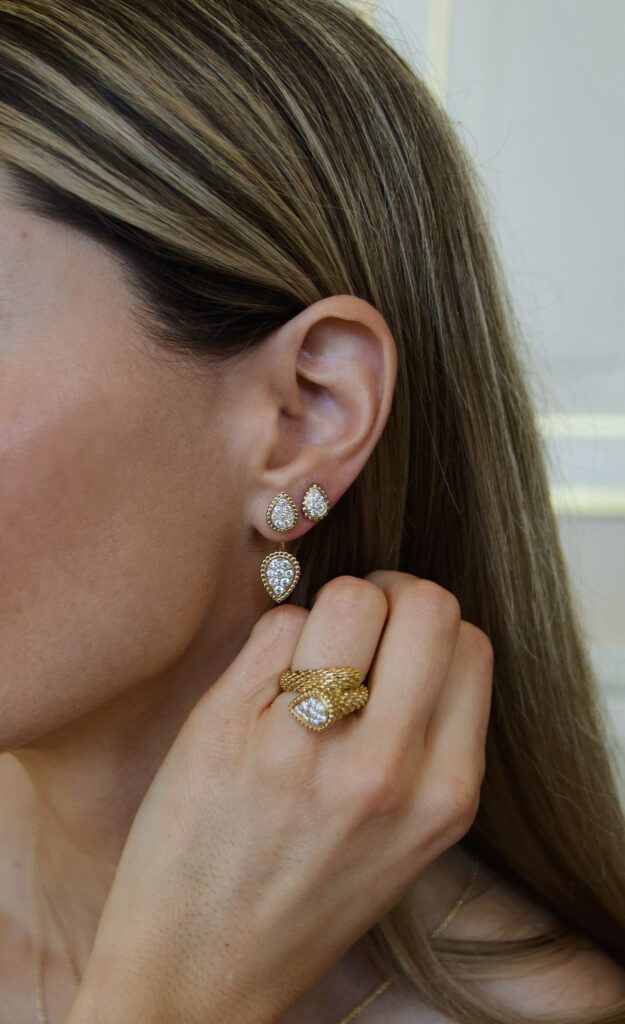 Close-up details of luxury fashion pieces serpent boheme boucheron highlighting exceptional craftsmanship, textures, and timeless design.